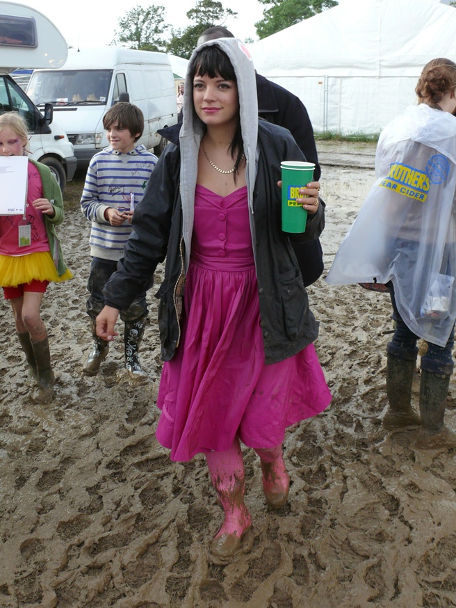 Lily Allen loving the mud backstage at the Glastonbury Festival