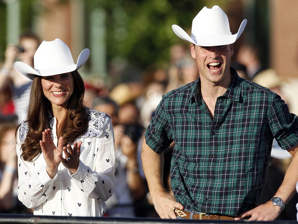 Britain's Prince William and his wife Catherine, Duchess of Cambridge watch bull riding in Calgary