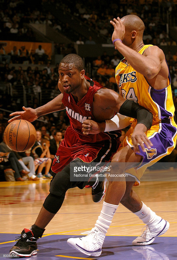 LOS ANGELES - FEBRUARY 28: Dwyane Wade #3 of the Miami Heat drives to the basket against Kobe Bryant #24 of the Los Angeles Lakers at Staples Center on February 28, 2008 in Los Angeles, California. NOTE TO USER: User expressly acknowledges and agrees that, by downloading and/or using this Photograph, user is consenting to the terms and conditions of the Getty Images License Agreement. Mandatory Copyright Notice: Copyright 2008 NBAE (Photo by Noah Graham/NBAE via Getty Images)