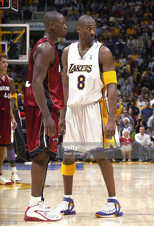 LOS ANGELES - DECEMBER 25: Kobe Bryant #8 of the Los Angeles Lakers stands next to Dwyane Wade #3 of the Miami Heat during the game on December 25, 2004 at the Staples Center in Los Angeles, California. The Heat won 104-102 in overtime. NOTE TO USER: User expressly acknowledges and agrees that, by downloading and/or using this Photograph, user is consenting to the terms and conditions of the Getty Images License Agreement. Mandatory Copyright Notice: Copyright 2004 NBAE (Photo by Noah Graham/NBAE via Getty Images) *** Local Caption *** Kobe Bryant;Dwyane Wade