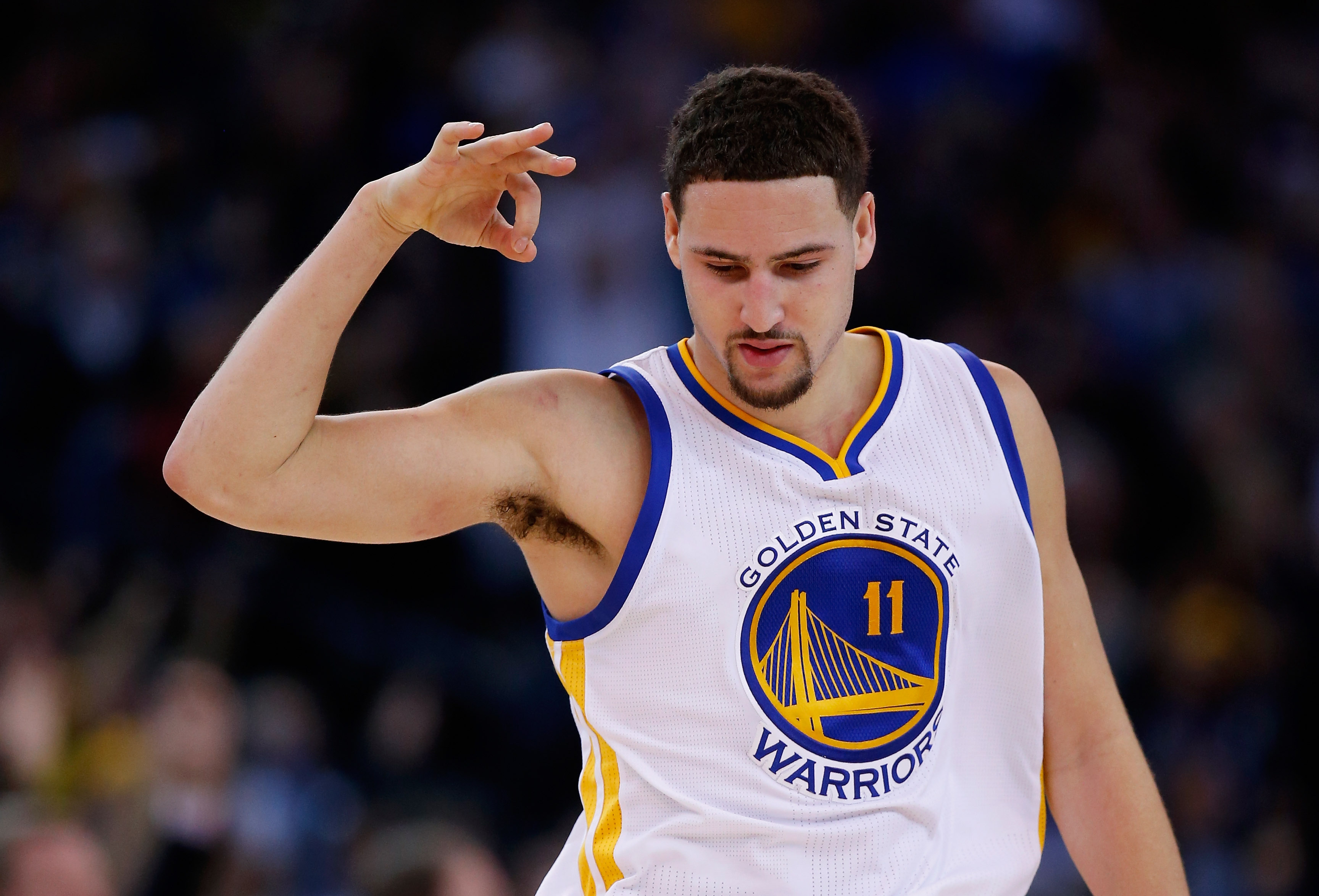 OAKLAND, CA - DECEMBER 16: Klay Thompson #11 of the Golden State Warriors reacts after making a three-point basket against the Phoenix Suns at ORACLE Arena on December 16, 2015 in Oakland, California. NOTE TO USER: User expressly acknowledges and agrees that, by downloading and or using this photograph, User is consenting to the terms and conditions of the Getty Images License Agreement. (Photo by Ezra Shaw/Getty Images)