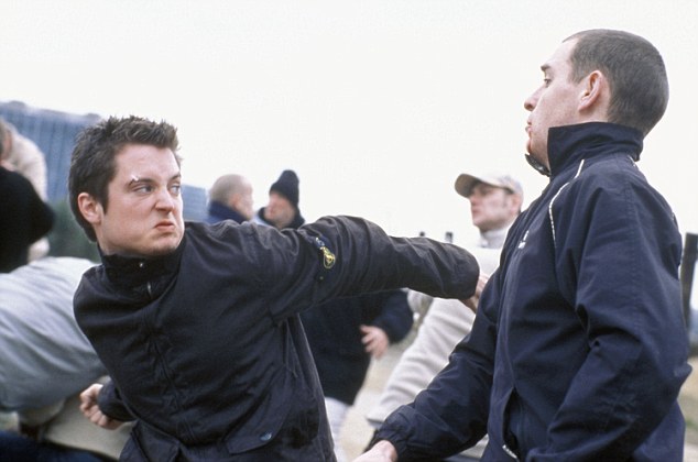 Pictured: Matt Bucker (ELIJAH WOOD) throws a punch at a member of the rival firm.