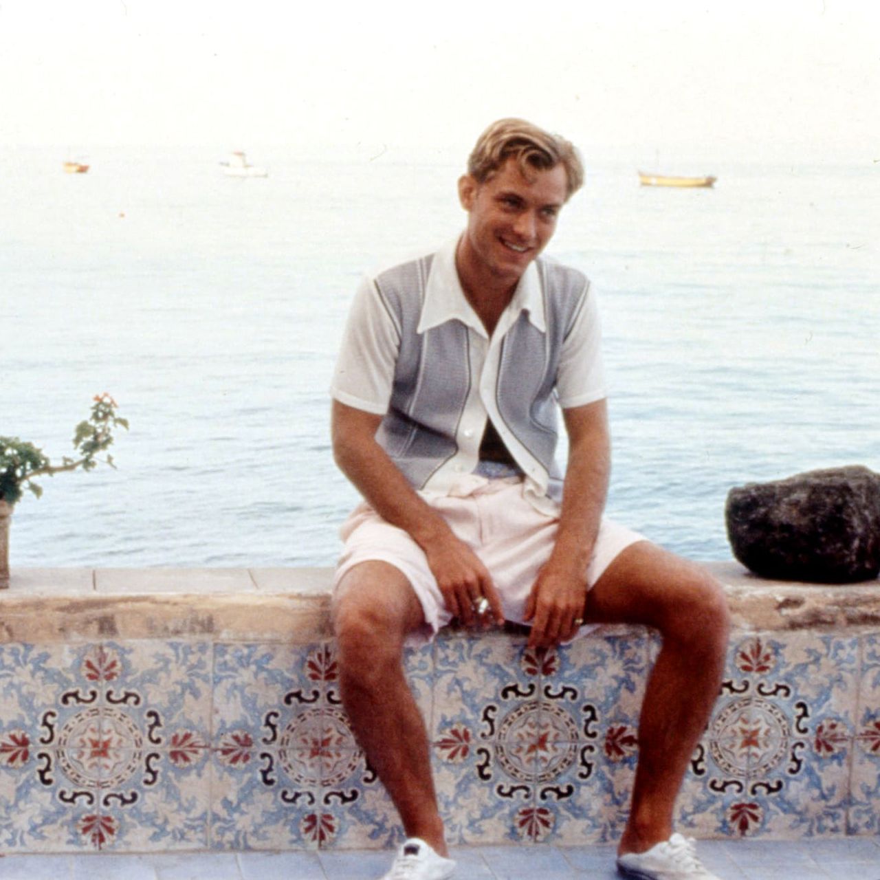 The Talented Mr. Ripley Dickie wearing button-front knitted shirt